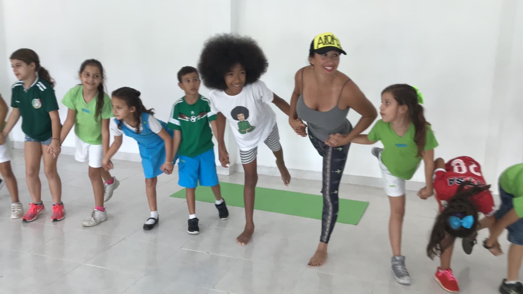Sahel and Tabay teaching yoga to children